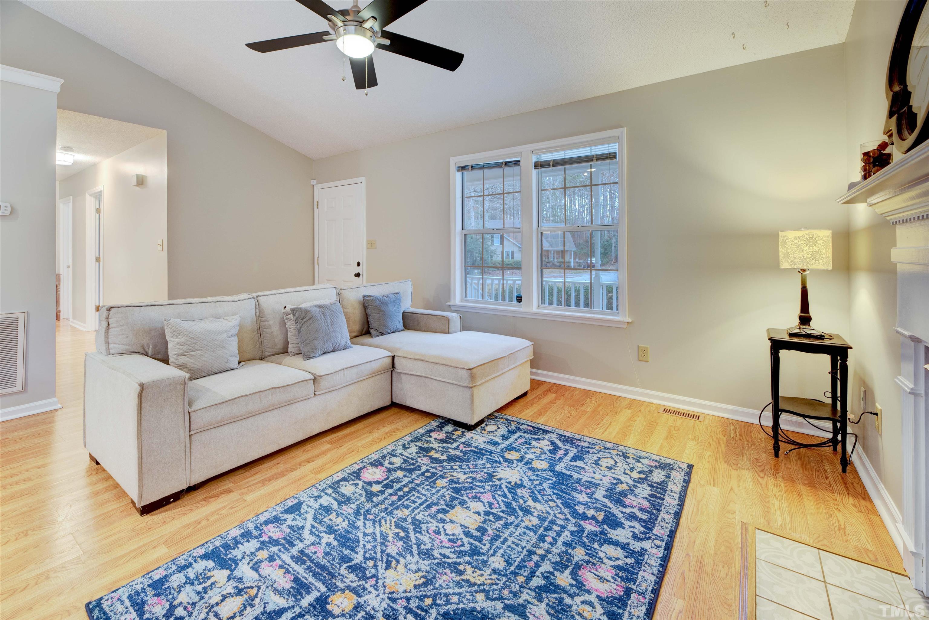 2305 Ruddy Road Raleigh, NC 27616 - Photo 11 of 37 a living room with furniture and a rug