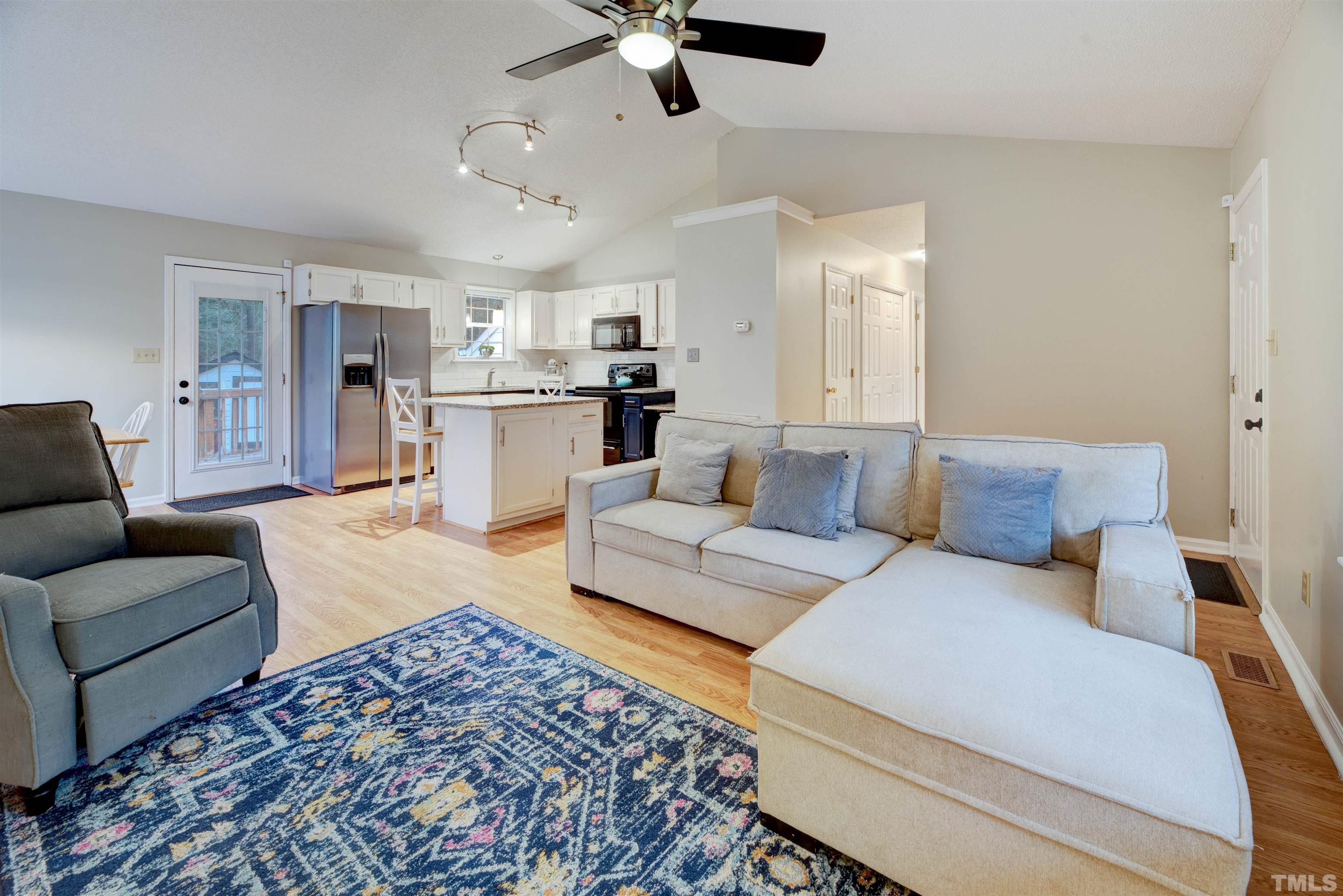 2305 Ruddy Road Raleigh, NC 27616 - Photo 12 of 37 a living room with furniture and kitchen view