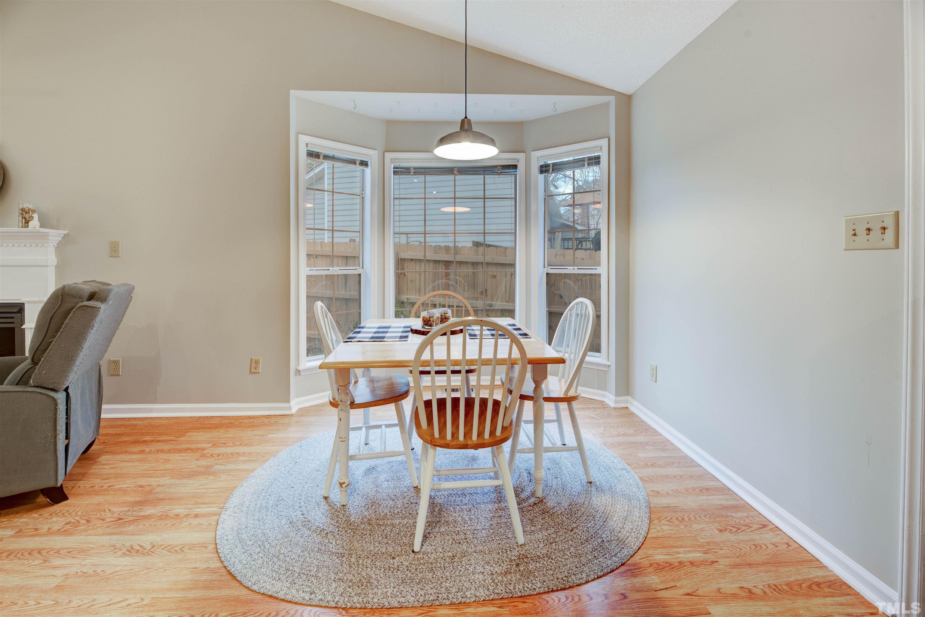 2305 Ruddy Road Raleigh, NC 27616 - Photo 14 of 37 a view of a dining room with furniture window and wooden floor