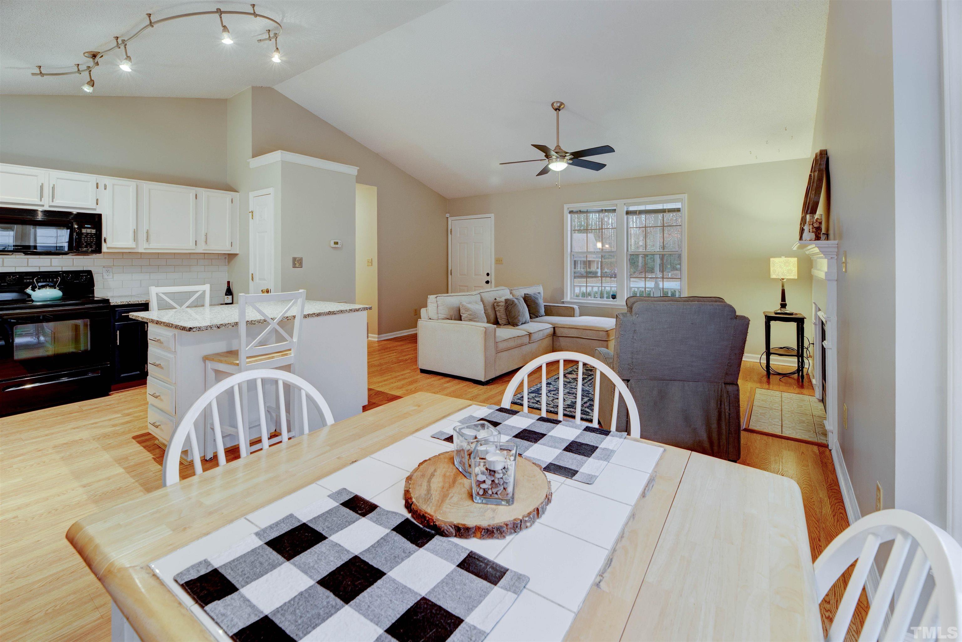 2305 Ruddy Road Raleigh, NC 27616 - Photo 15 of 37 a living room with furniture and a dining table