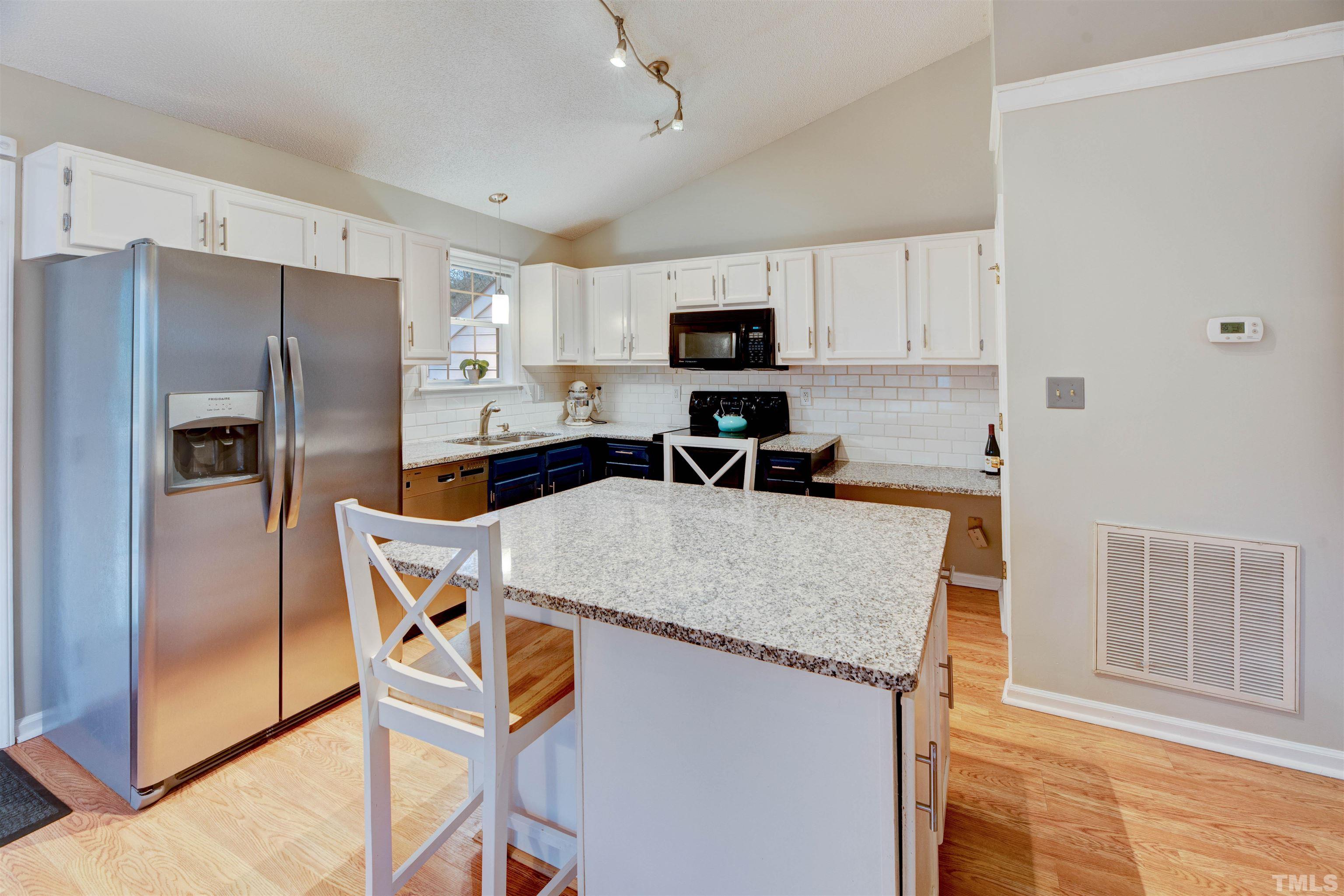 2305 Ruddy Road Raleigh, NC 27616 - Photo 16 of 37 a kitchen with stainless steel appliances granite countertop a refrigerator stove microwave and sink