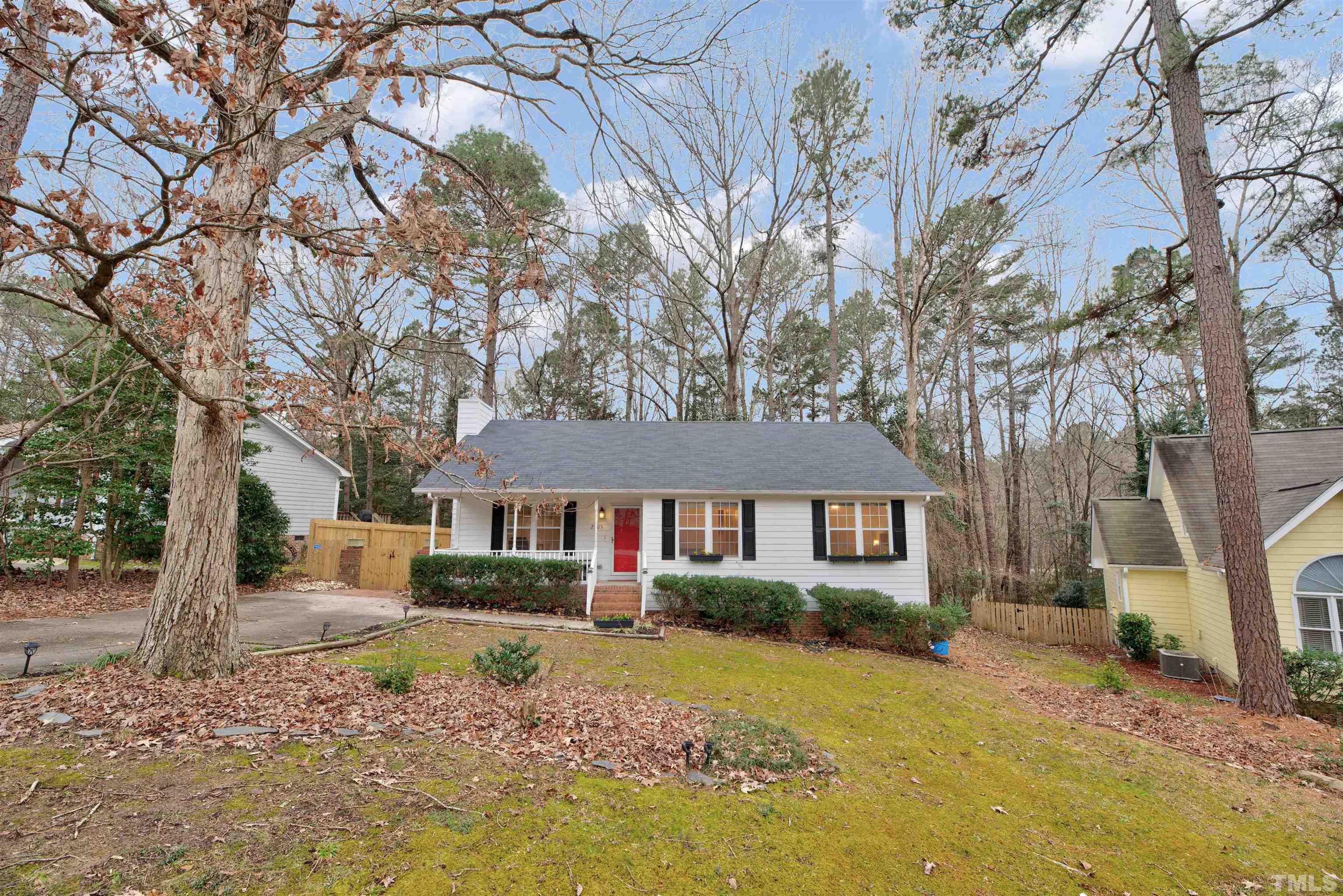 2305 Ruddy Road Raleigh, NC 27616 - Photo 2 of 37 a front view of a house with a yard tree and outdoor seating