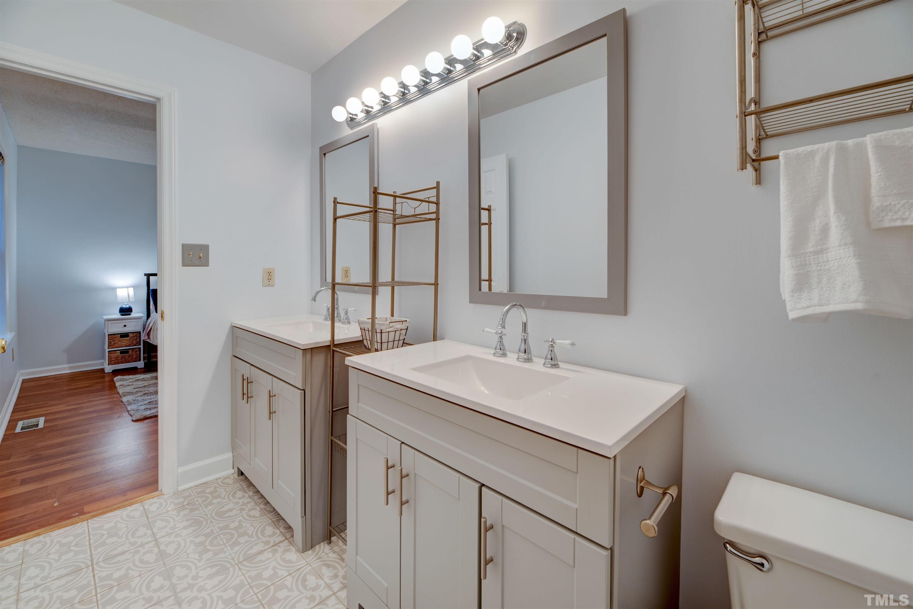 2305 Ruddy Road Raleigh, NC 27616 - Photo 33 of 37 a bathroom with a sink and a mirror