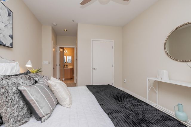 a bedroom with a bed and lamp