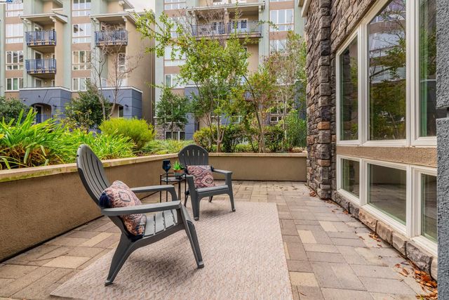 a view of a building with sitting area