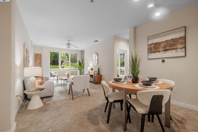 a dining room with furniture and window
