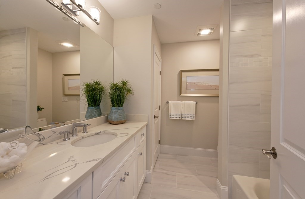 6 Robert Drive, Unit 23 Andover, MA 01810 - Photo 18 of 21 a bathroom with a sink a toilet and shower