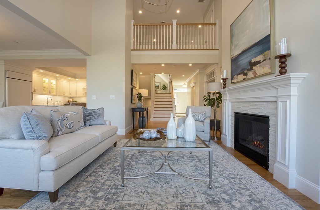 6 Robert Drive, Unit 23 Andover, MA 01810 - Photo 3 of 21 a living room with furniture and a fireplace