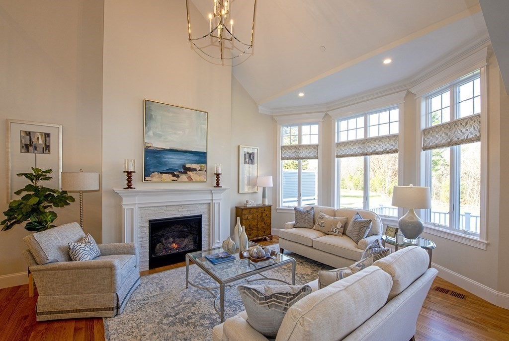 6 Robert Drive, Unit 23 Andover, MA 01810 - Photo 4 of 21 a living room with furniture a fireplace and a large window