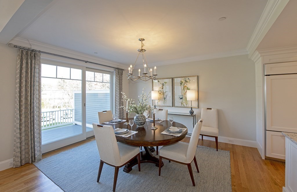 6 Robert Drive, Unit 23 Andover, MA 01810 - Photo 5 of 21 a view of a dining room with furniture and wooden floor