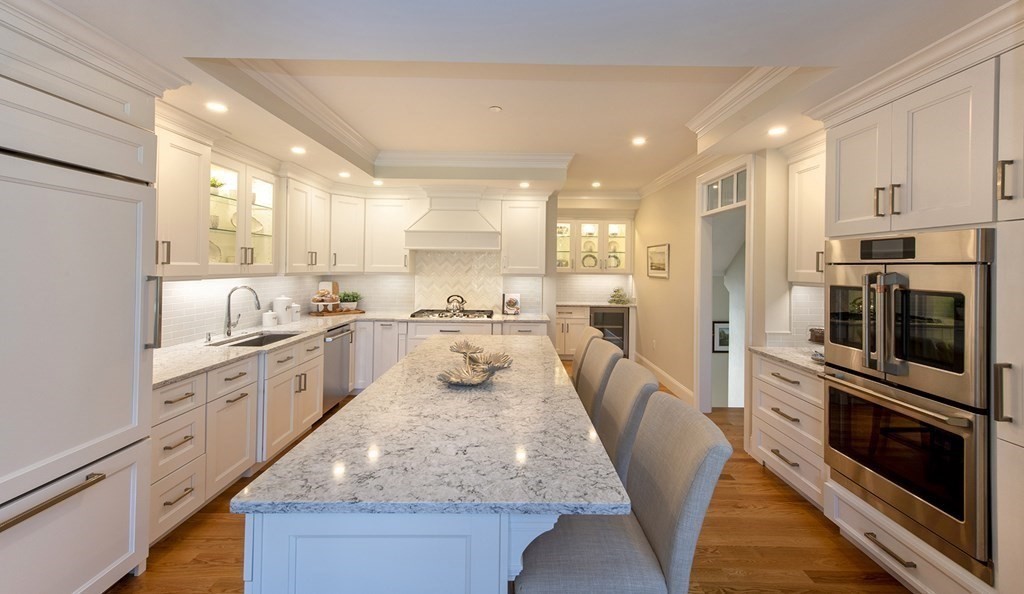 6 Robert Drive, Unit 23 Andover, MA 01810 - Photo 7 of 21 a large kitchen with stainless steel appliances kitchen island granite countertop a large counter top stainless steel appliances and cabinets