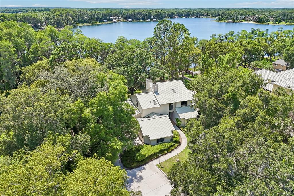 17810 Crawley Road Odessa, FL 33556 - Photo 66 of 76 an aerial view of a house with a yard and lake view