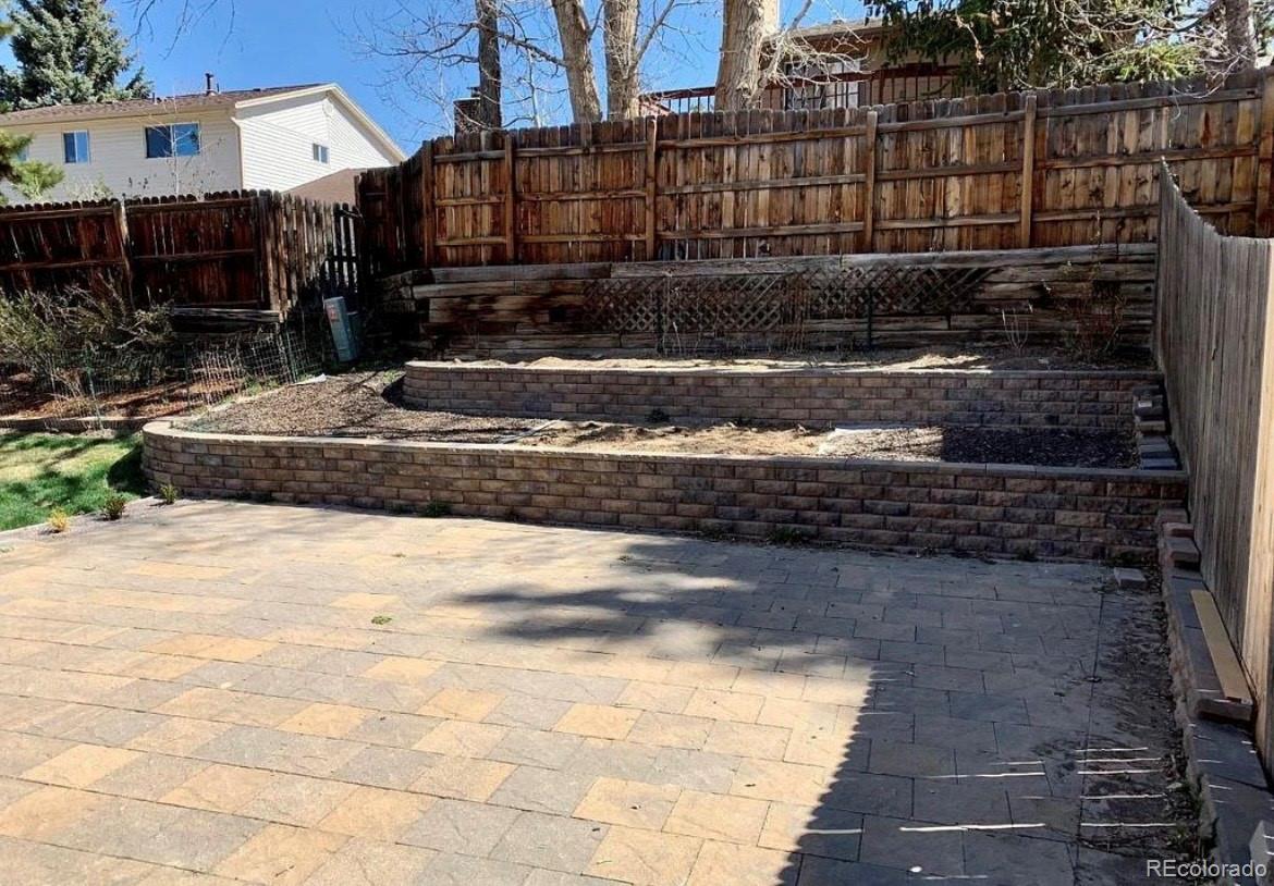 13134 Peacock Drive Lone Tree, CO 80124 - Photo 11 of 11 a view of a house with a yard