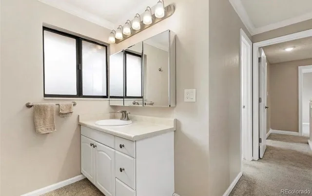 a bathroom with a sink a vanity and a mirror
