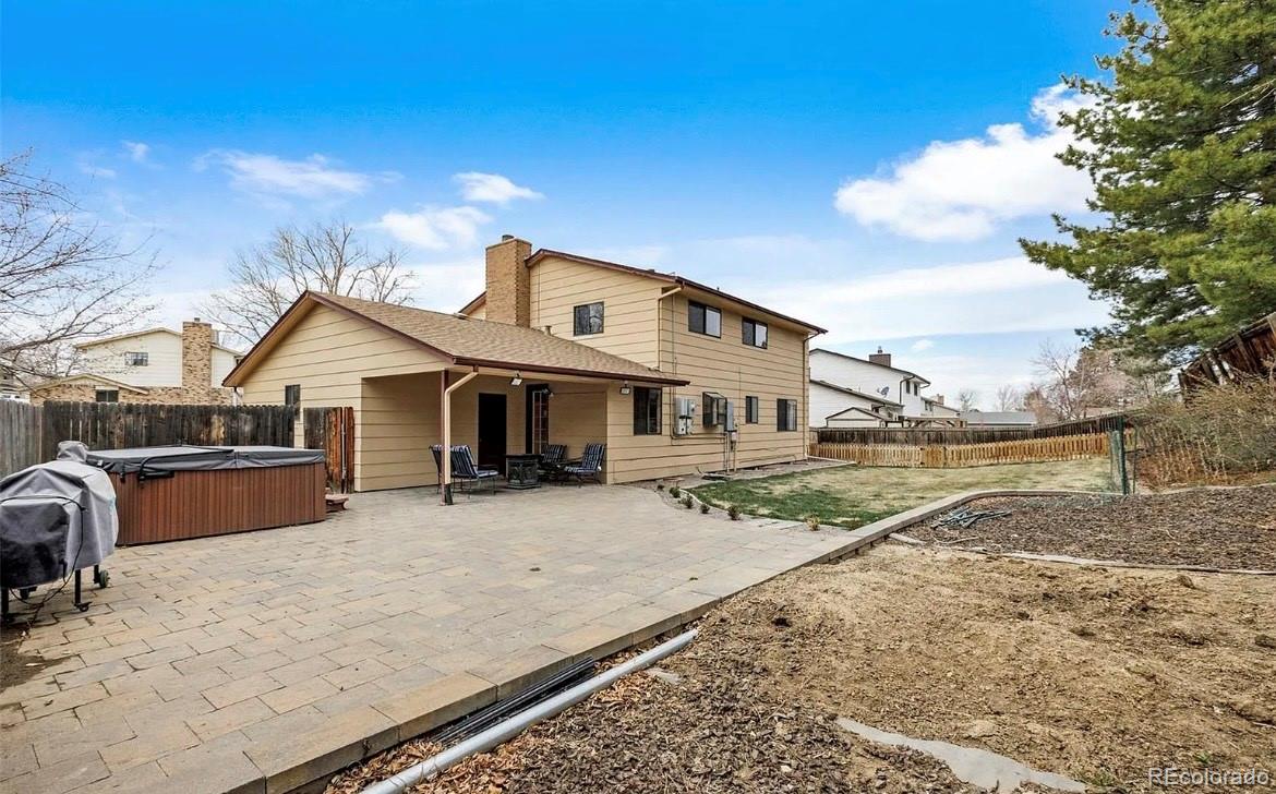 13134 Peacock Drive Lone Tree, CO 80124 - Photo 9 of 11 a front view of a house with garden