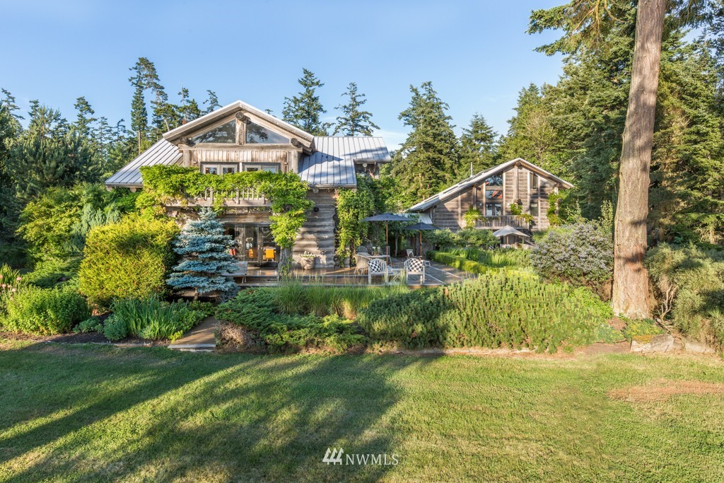 953 Lopez Road Lopez Island, WA 98261 - Photo 3 of 25 a front view of a house with a yard