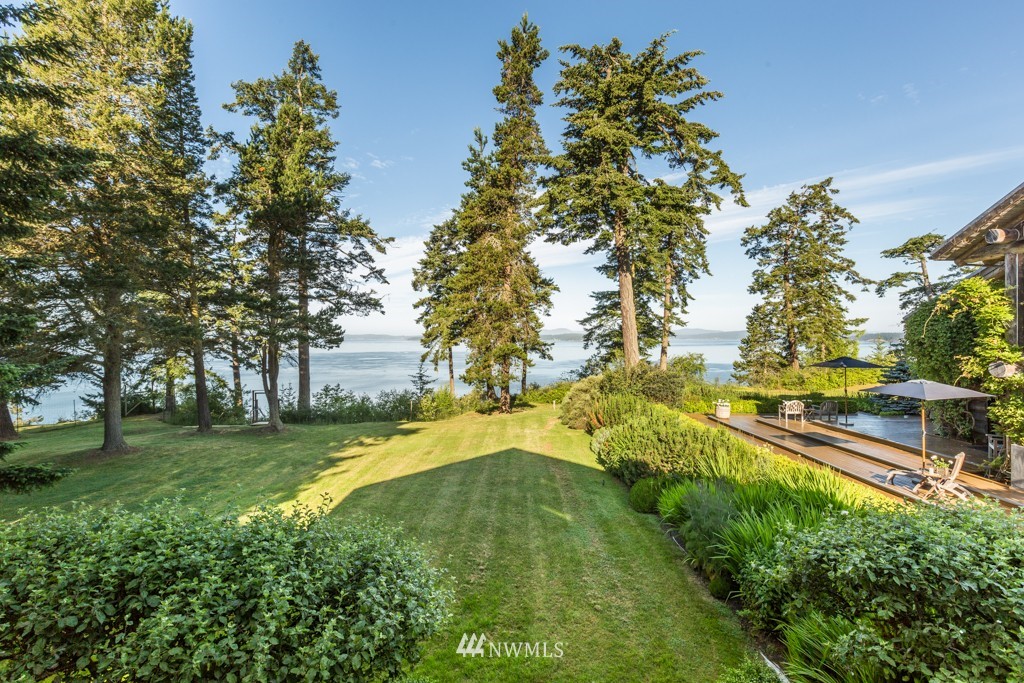 953 Lopez Road Lopez Island, WA 98261 - Photo 4 of 25 a view of a swimming pool with a yard