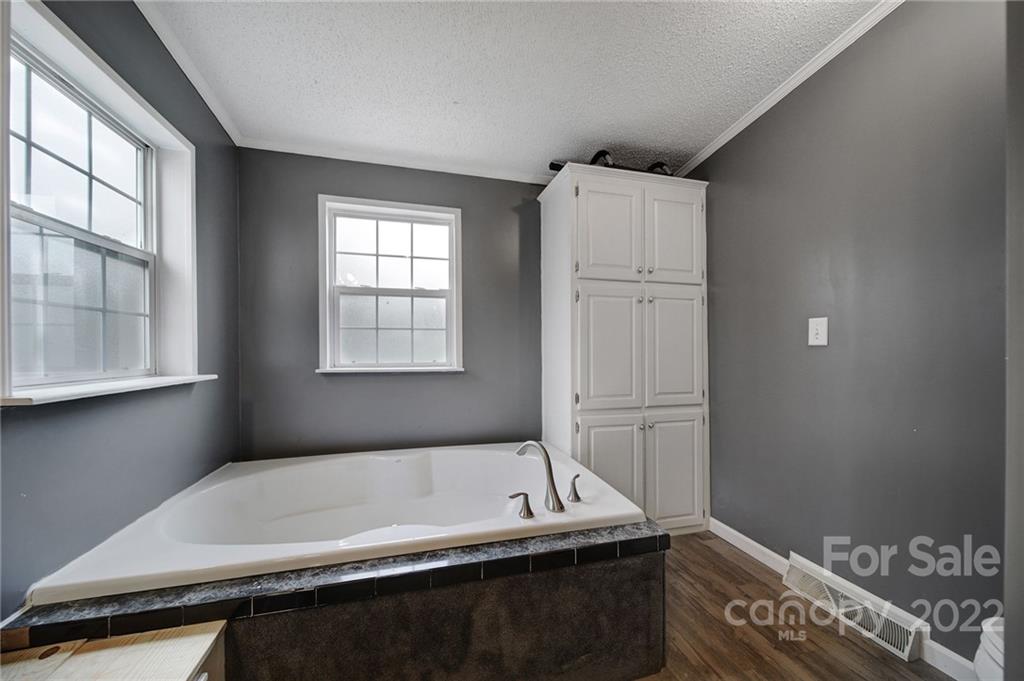 141 Old Hearth Road Clover, SC 29710 - Photo 20 of 29 a bathroom with a bathtub and a window