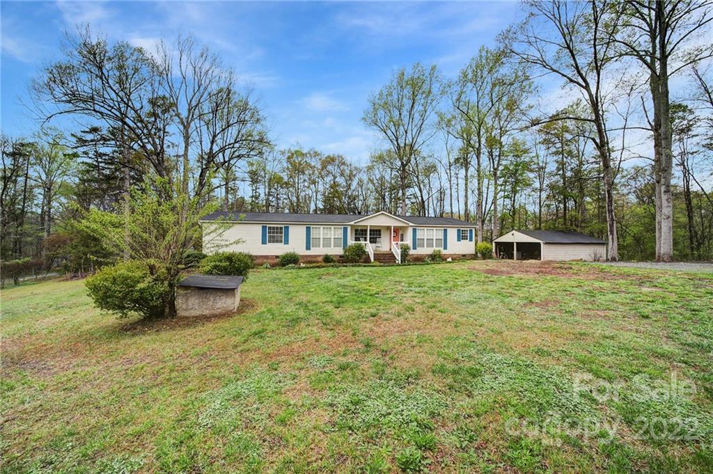 141 Old Hearth Road Clover, SC 29710 - Photo 27 of 29 a view of a house with backyard and sitting area