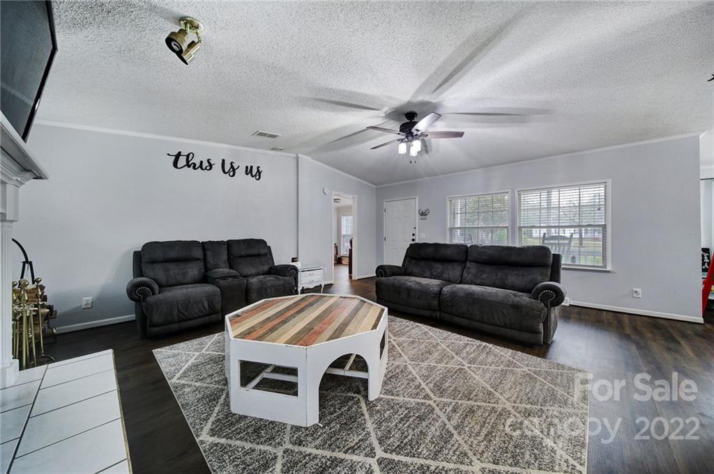 141 Old Hearth Road Clover, SC 29710 - Photo 4 of 29 a living room with furniture and a ceiling fan