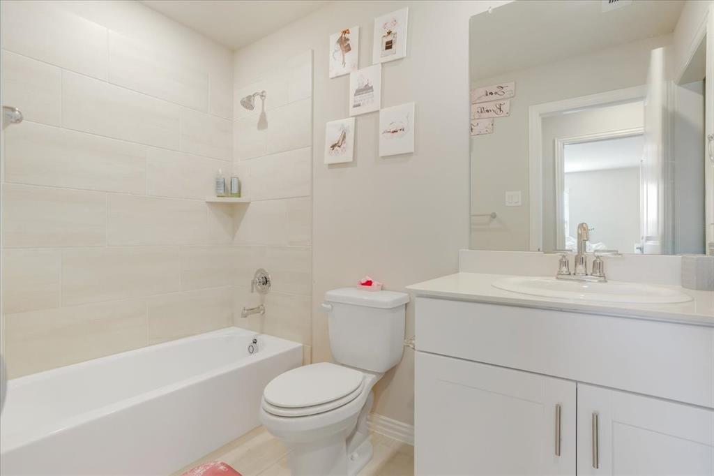 3806 Richland Drive Farmersville, TX 75442 - Photo 17 of 25 a bathroom with a sink toilet vanity and tub
