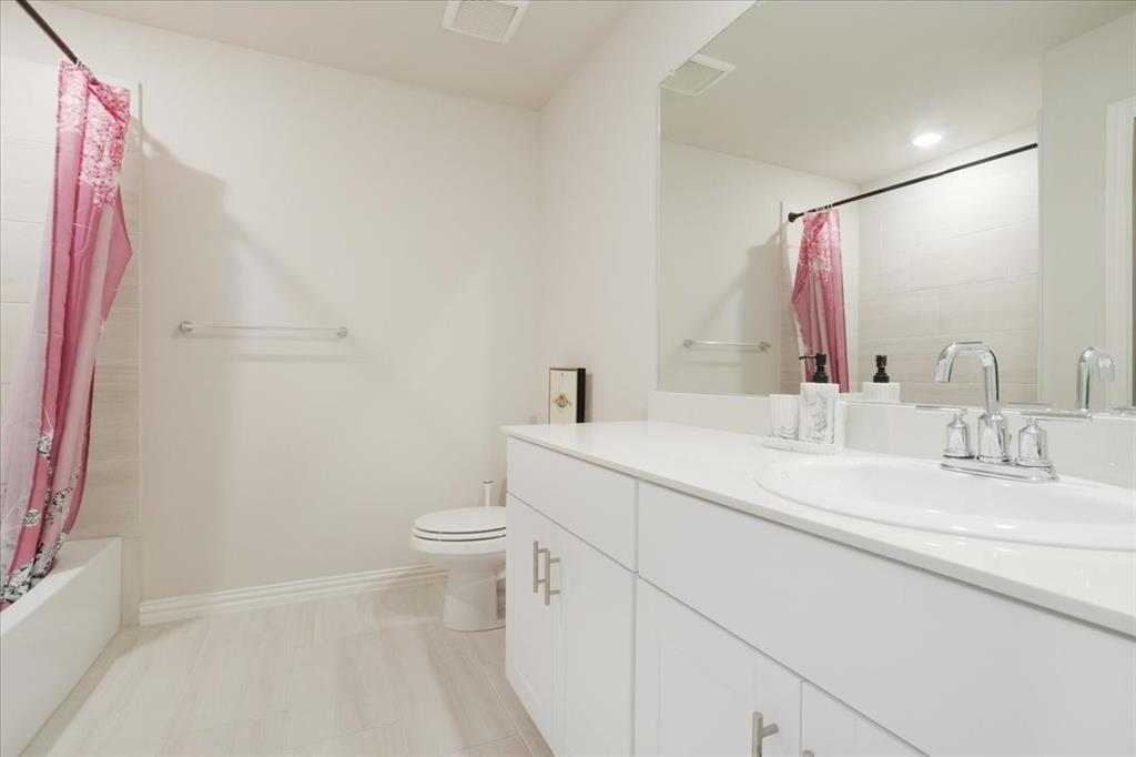 3806 Richland Drive Farmersville, TX 75442 - Photo 20 of 25 a bathroom with a sink a toilet and a mirror