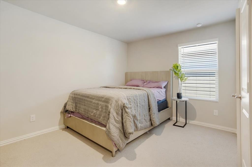 3806 Richland Drive Farmersville, TX 75442 - Photo 21 of 25 a bedroom with a bed and a chair