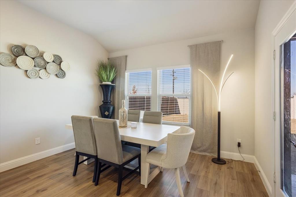 3806 Richland Drive Farmersville, TX 75442 - Photo 7 of 25 a view of a dining room with furniture window and wooden floor