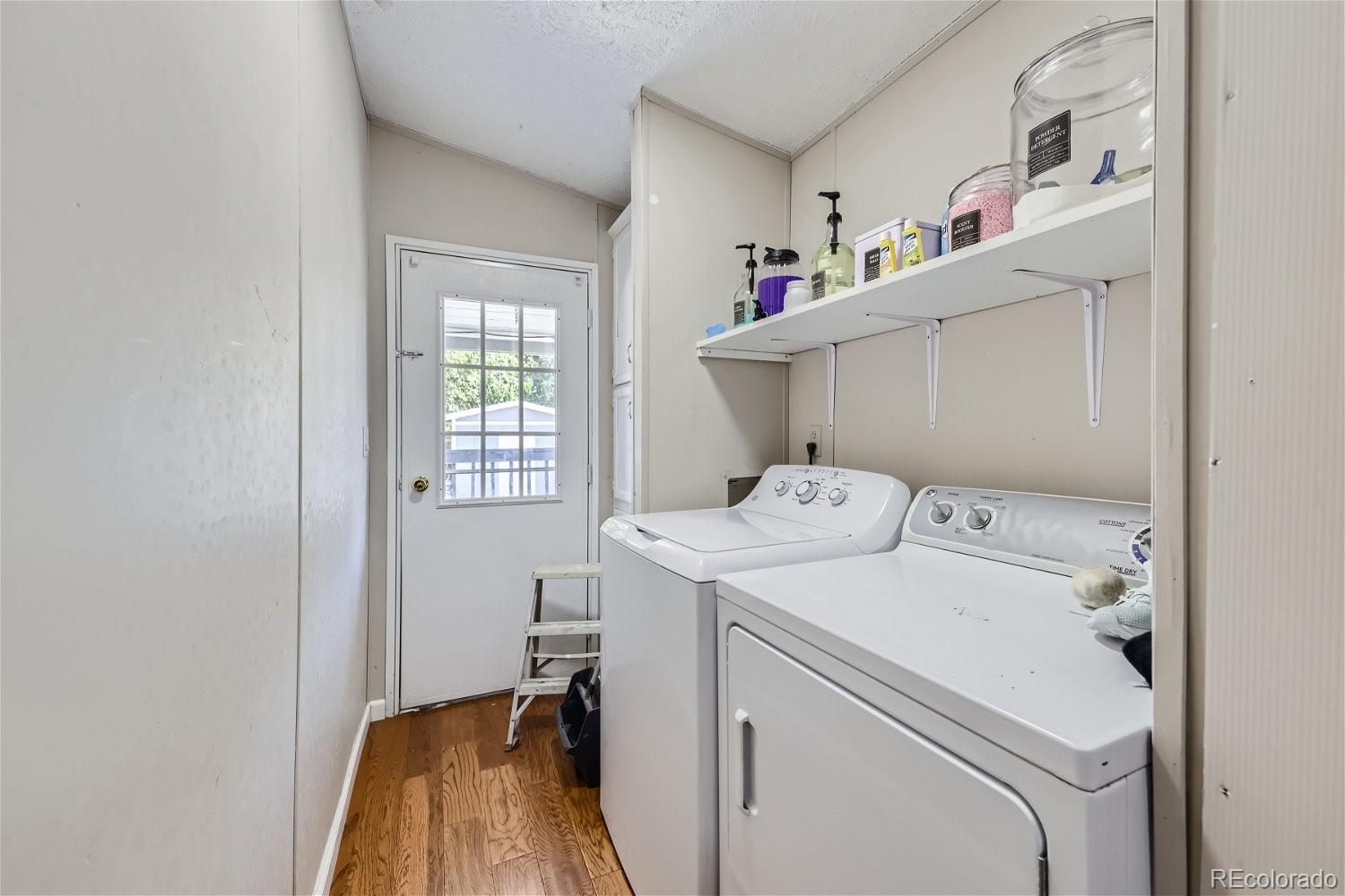 11682 Frederick Street Fort Lupton, CO 80621 - Photo 9 of 11 a utility room with dryer and washer