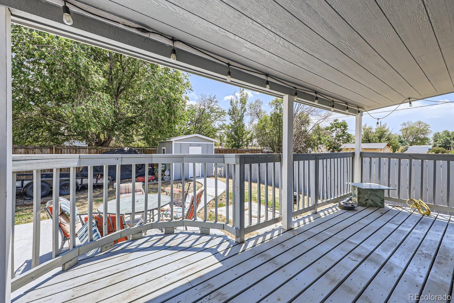 11682 Frederick Street Fort Lupton, CO 80621 - Photo 10 of 11 a view of balcony with wooden floor