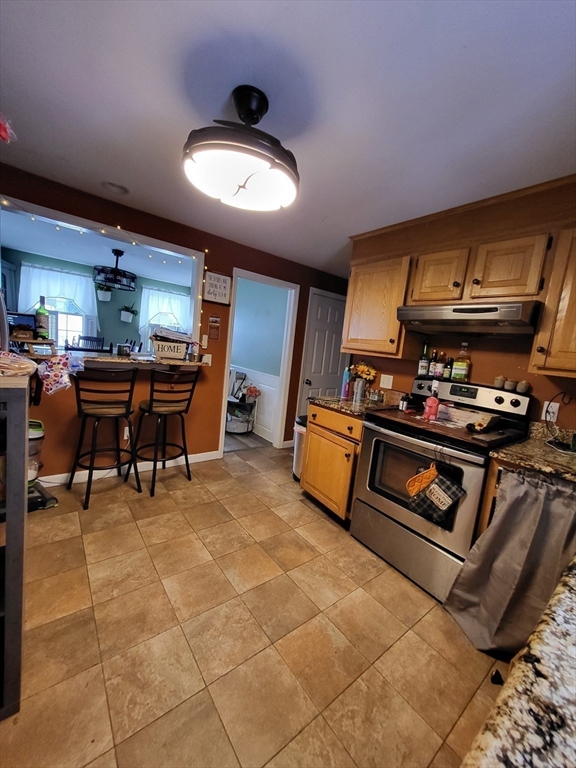 13 Ridge Road Southbridge, MA 01550 - Photo 3 of 11 a kitchen with stainless steel appliances kitchen island granite countertop a sink and cabinets