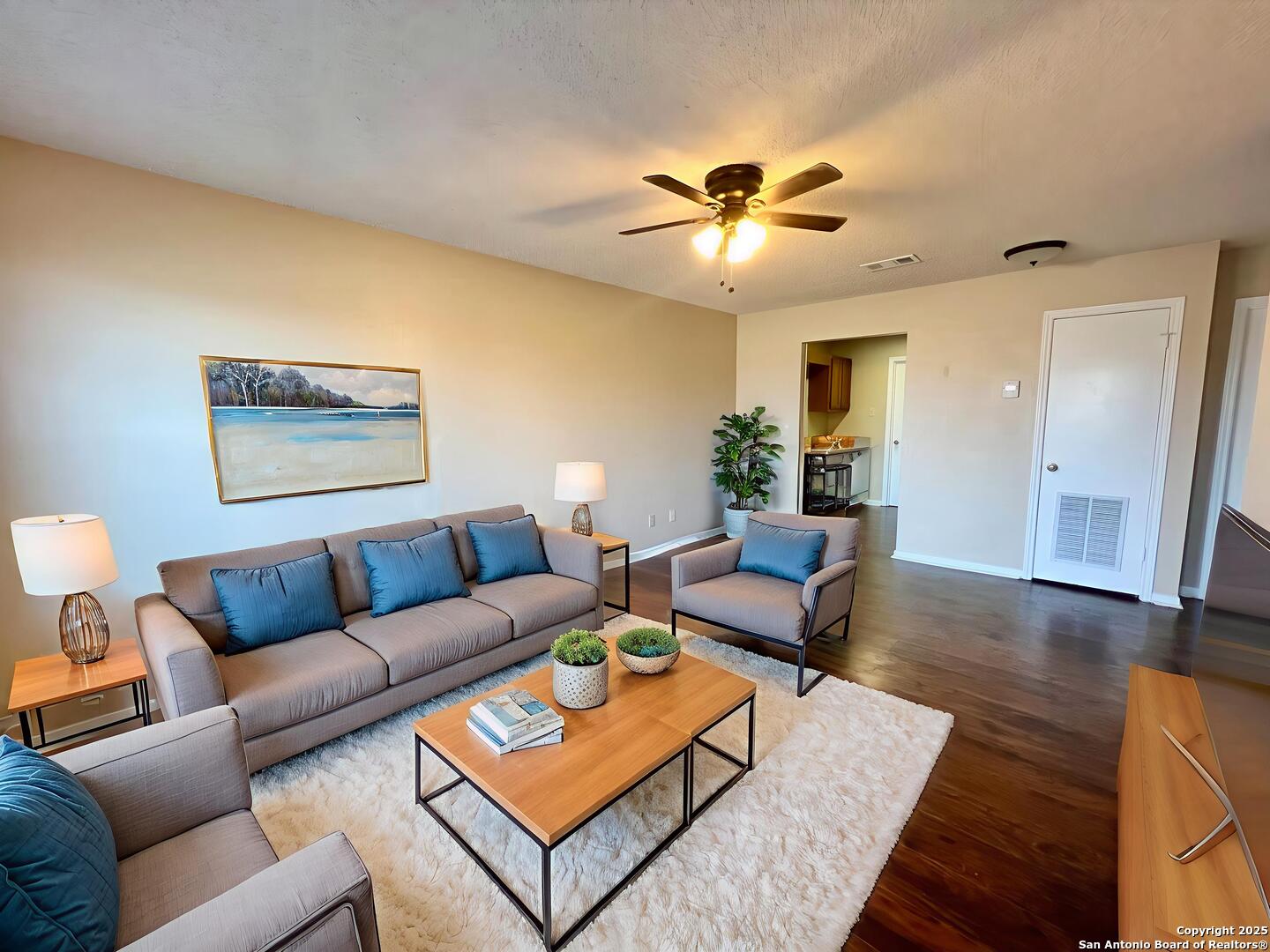 4545 Hoeneke Drive, Unit 103 Kirby, TX 78219 - Photo 1 of 19 a living room with furniture and a wooden floor