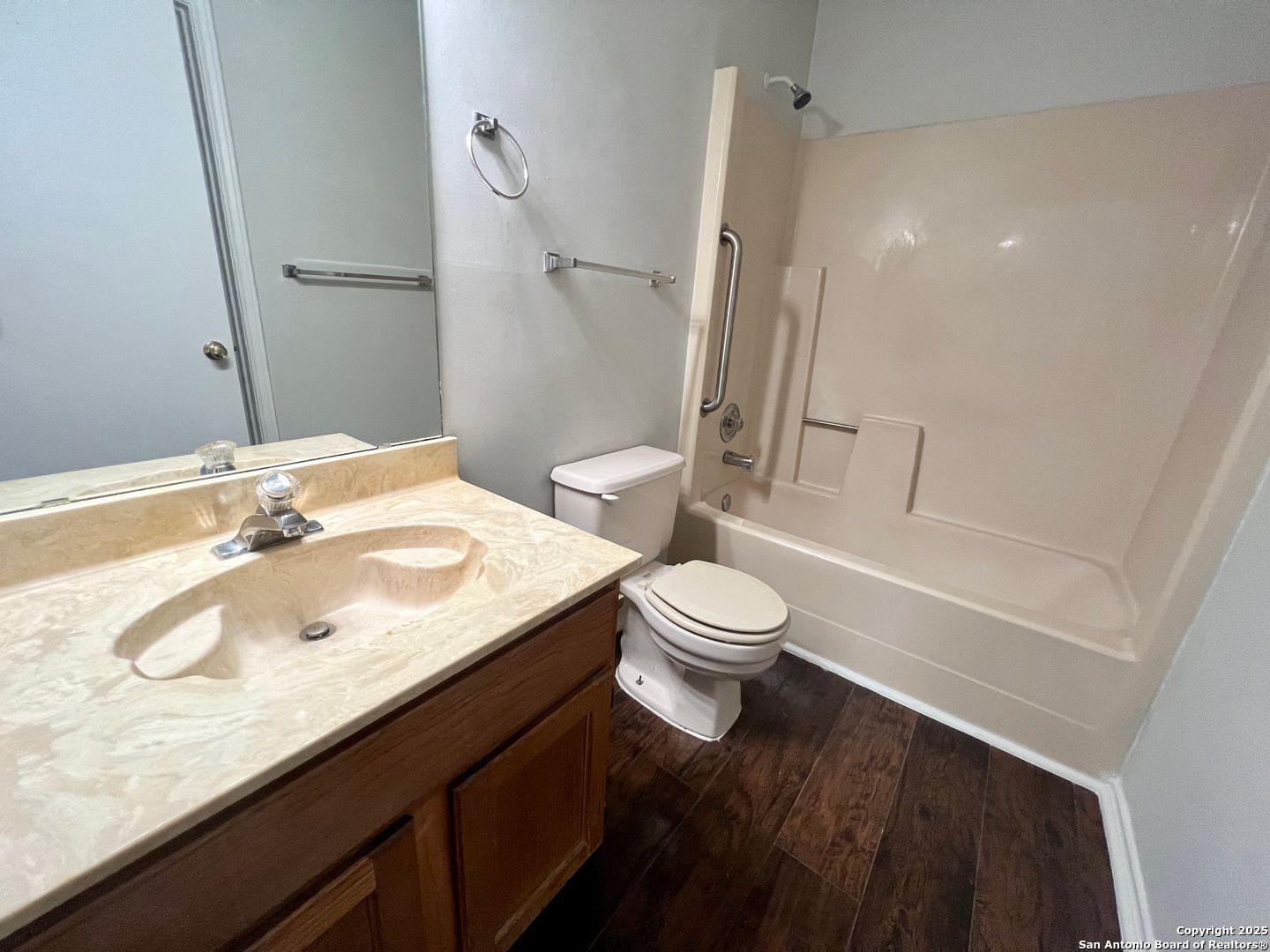 4545 Hoeneke Drive, Unit 103 Kirby, TX 78219 - Photo 11 of 19 a bathroom with a sink a toilet and shower