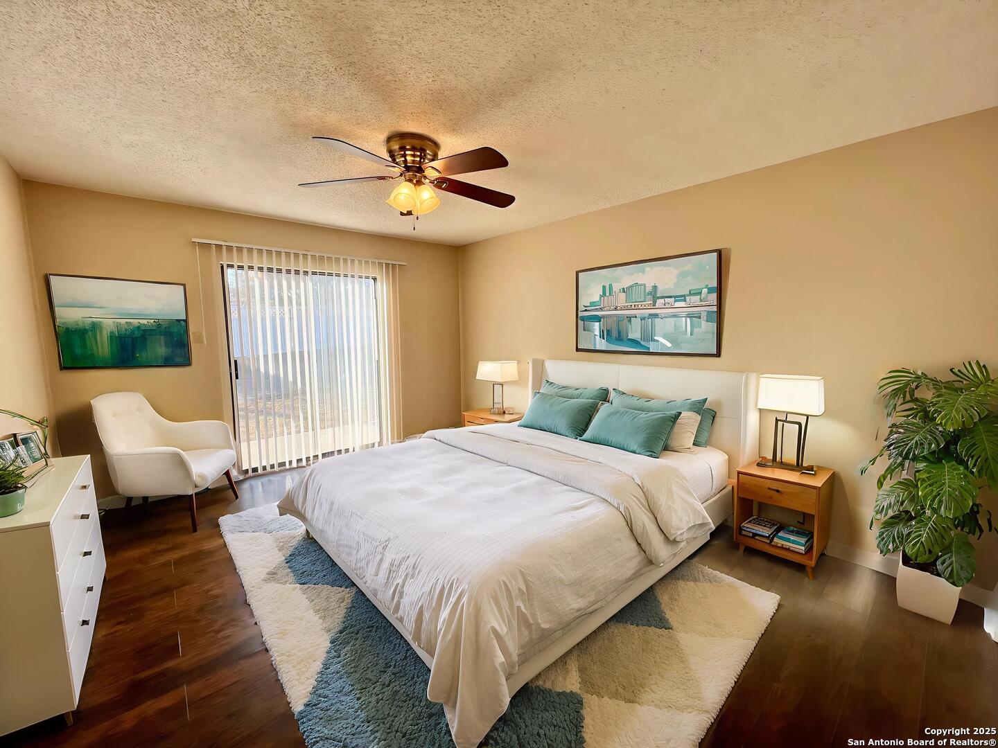 4545 Hoeneke Drive, Unit 103 Kirby, TX 78219 - Photo 12 of 19 a spacious bedroom with a bed couch and a window