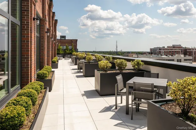 a view of a terrace with furniture