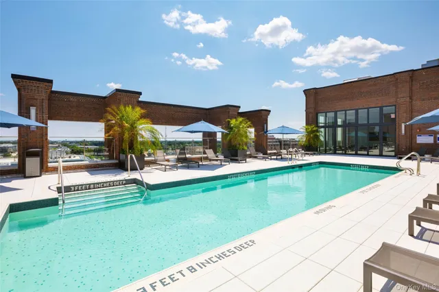 a view of a swimming pool with a lounge chairs