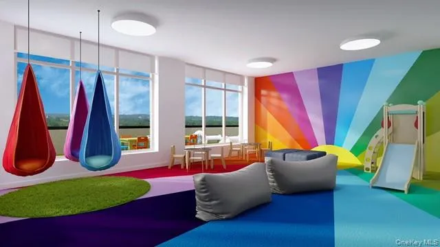 a living room with a couch and a large window