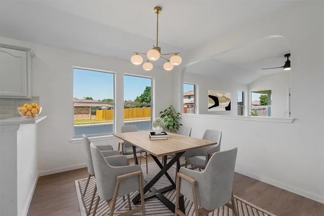 a dining room with furniture and window