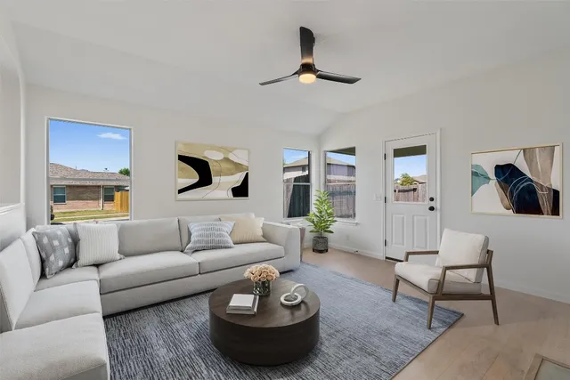 a living room with furniture and a large window