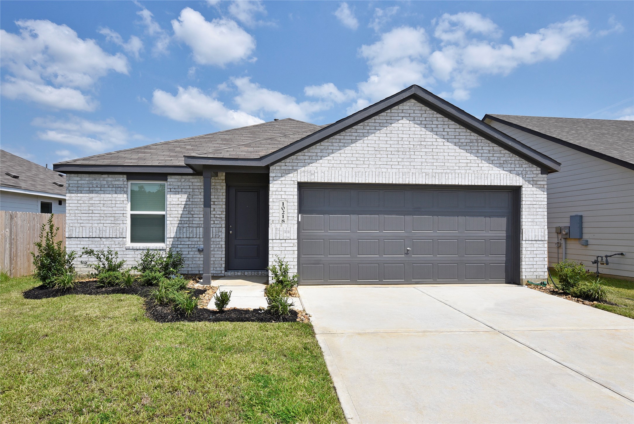 10218 Prairie Dunes Lane Cleveland, TX 77327 - Photo 1 of 32 a front view of house with yard
