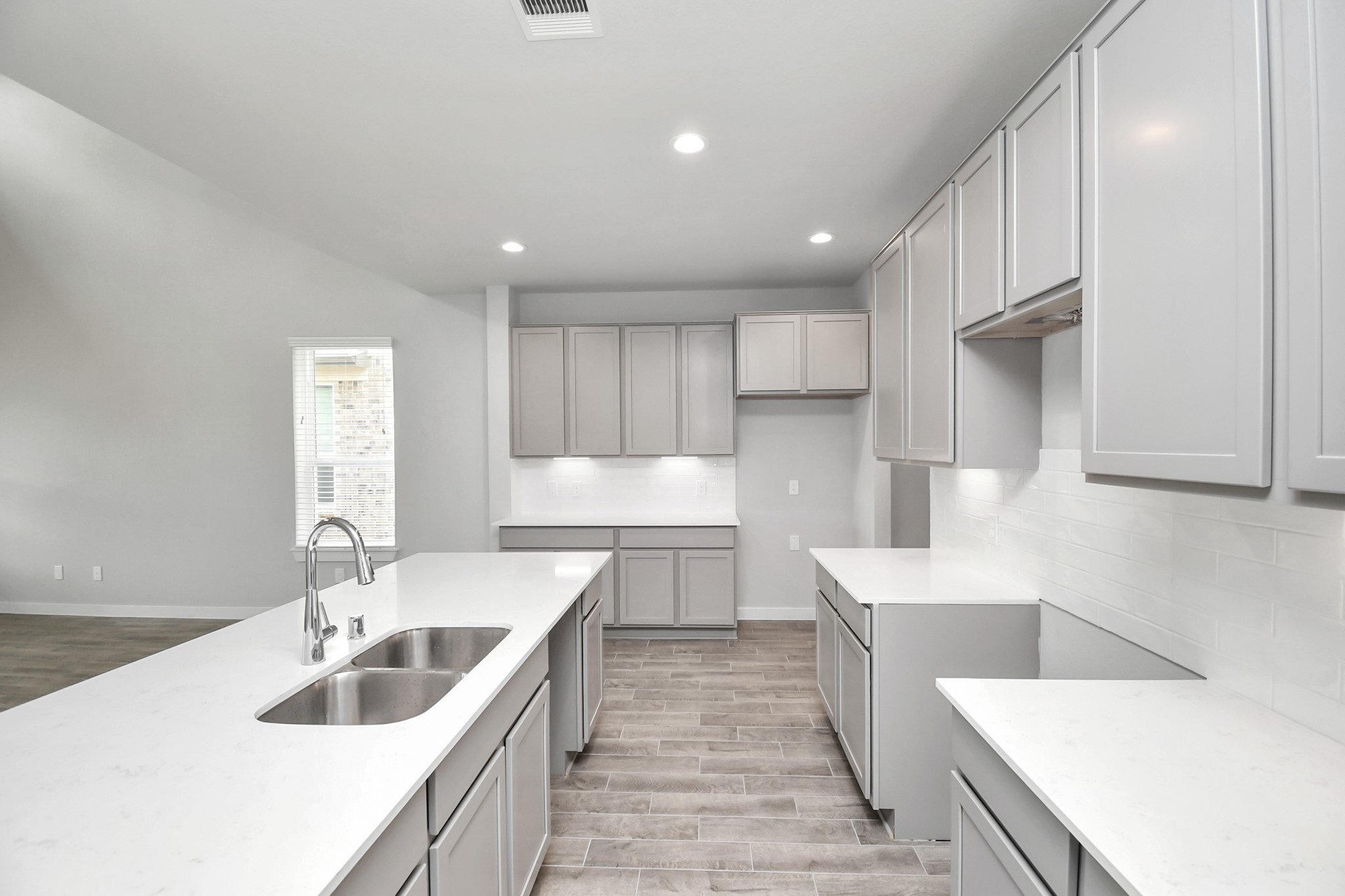 15806 Telge Ridge Lane Cypress, TX 77429 - Photo 15 of 40 a large white kitchen with a sink dishwasher stove and refrigerator