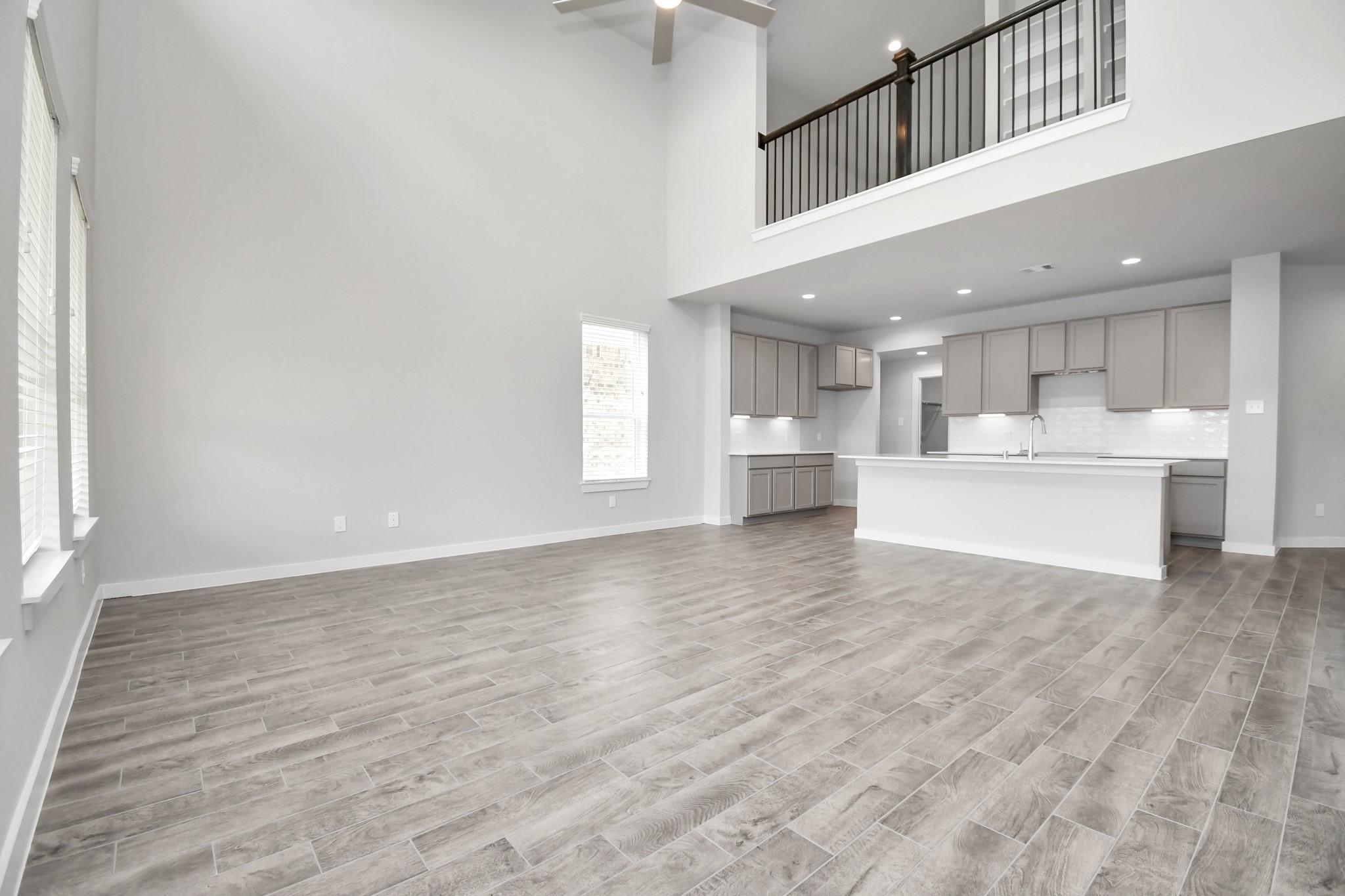 15806 Telge Ridge Lane Cypress, TX 77429 - Photo 21 of 40 a view of a kitchen with kitchen island stainless steel appliances wooden floor and window