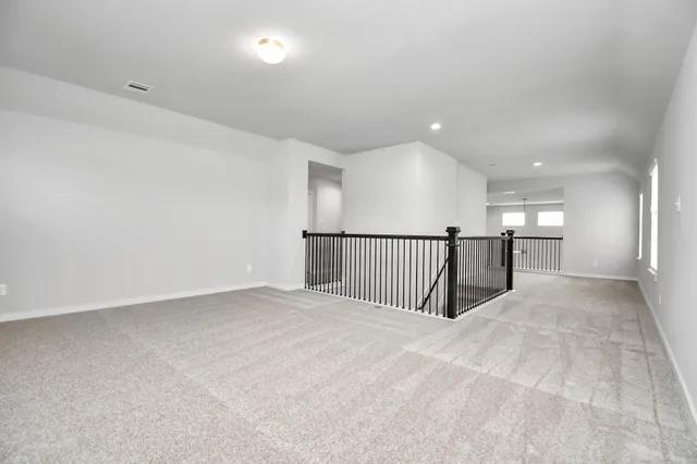 an empty room with closet area