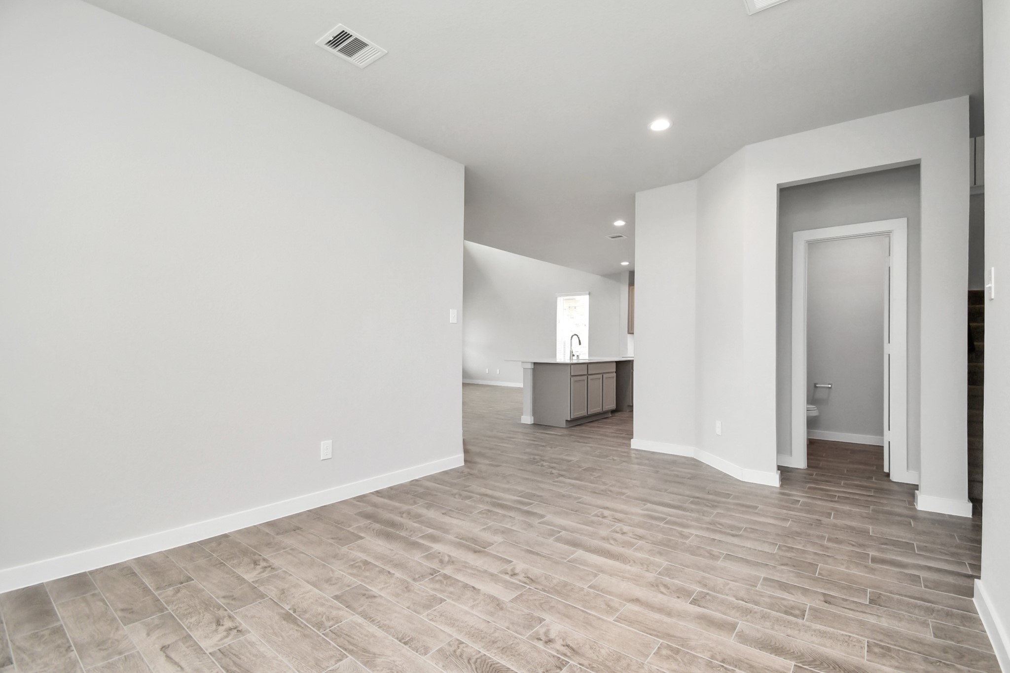 15806 Telge Ridge Lane Cypress, TX 77429 - Photo 12 of 40 a view of a big room with wooden floor and windows