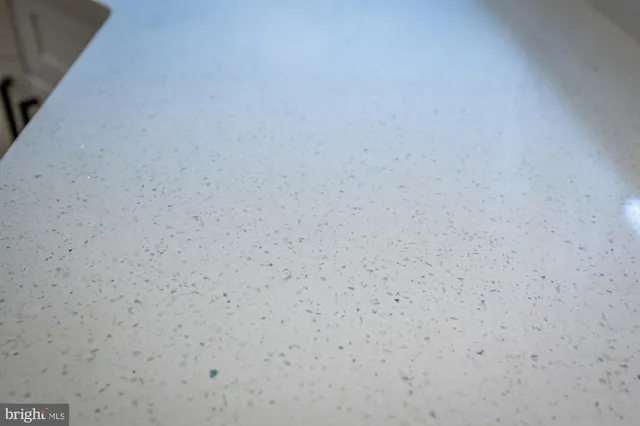 a close up of a white marble wall