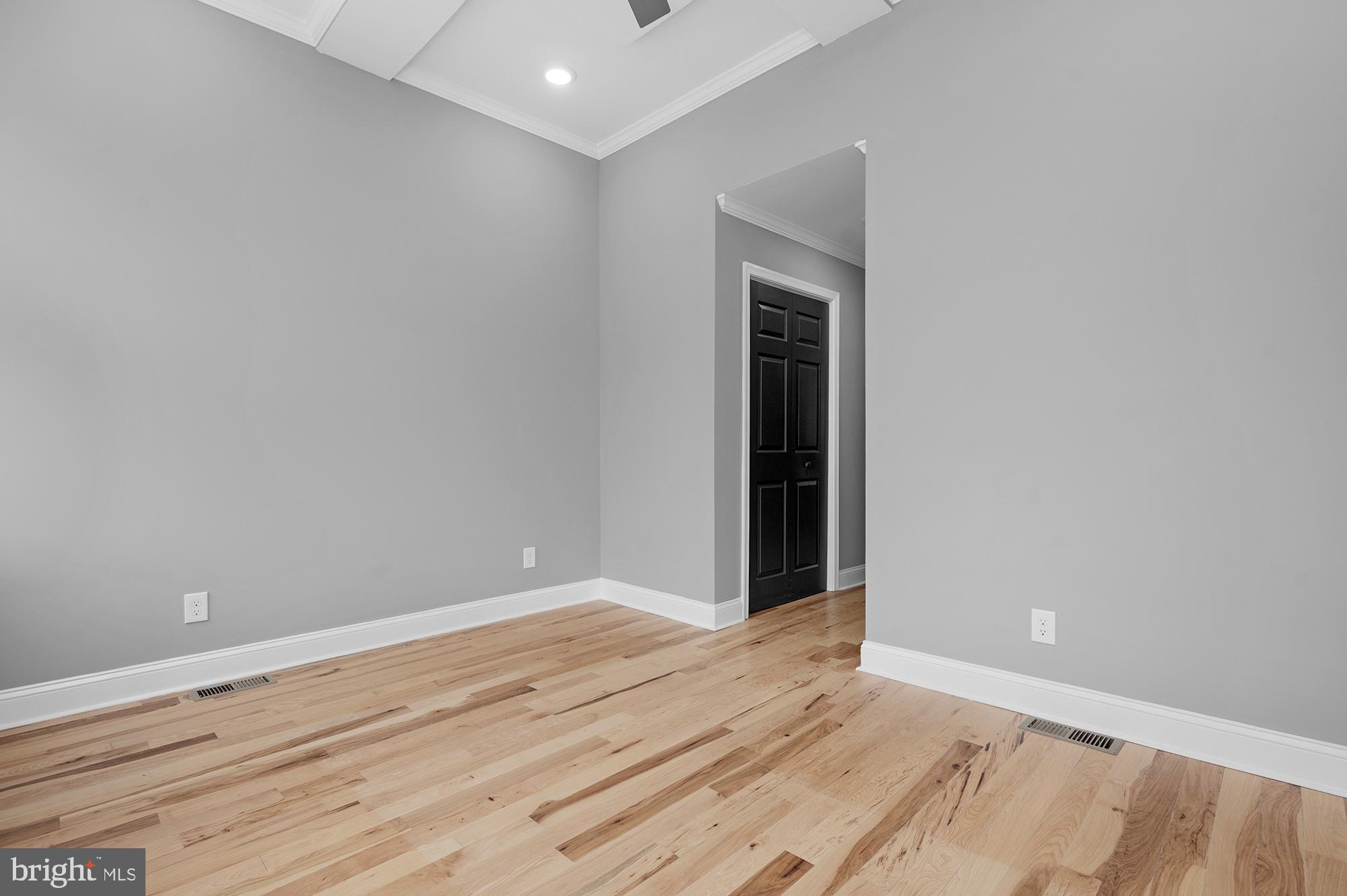 1908 East Lanvale Street Baltimore, MD 21213 - Photo 21 of 49 a view of an empty room with wooden floor
