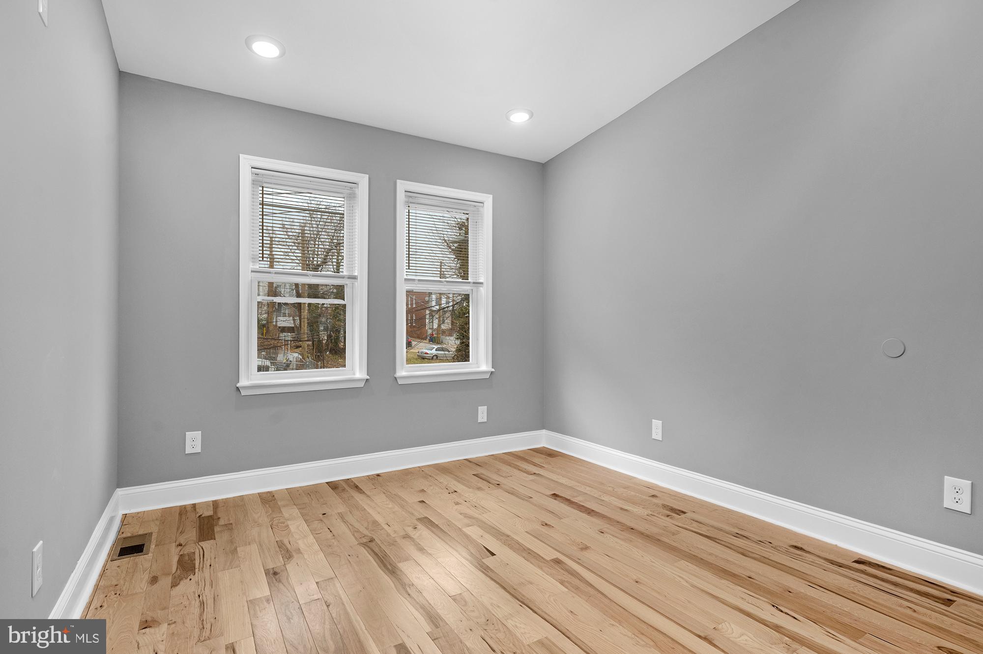 1908 East Lanvale Street Baltimore, MD 21213 - Photo 27 of 49 a view of empty room with wooden floor and fan
