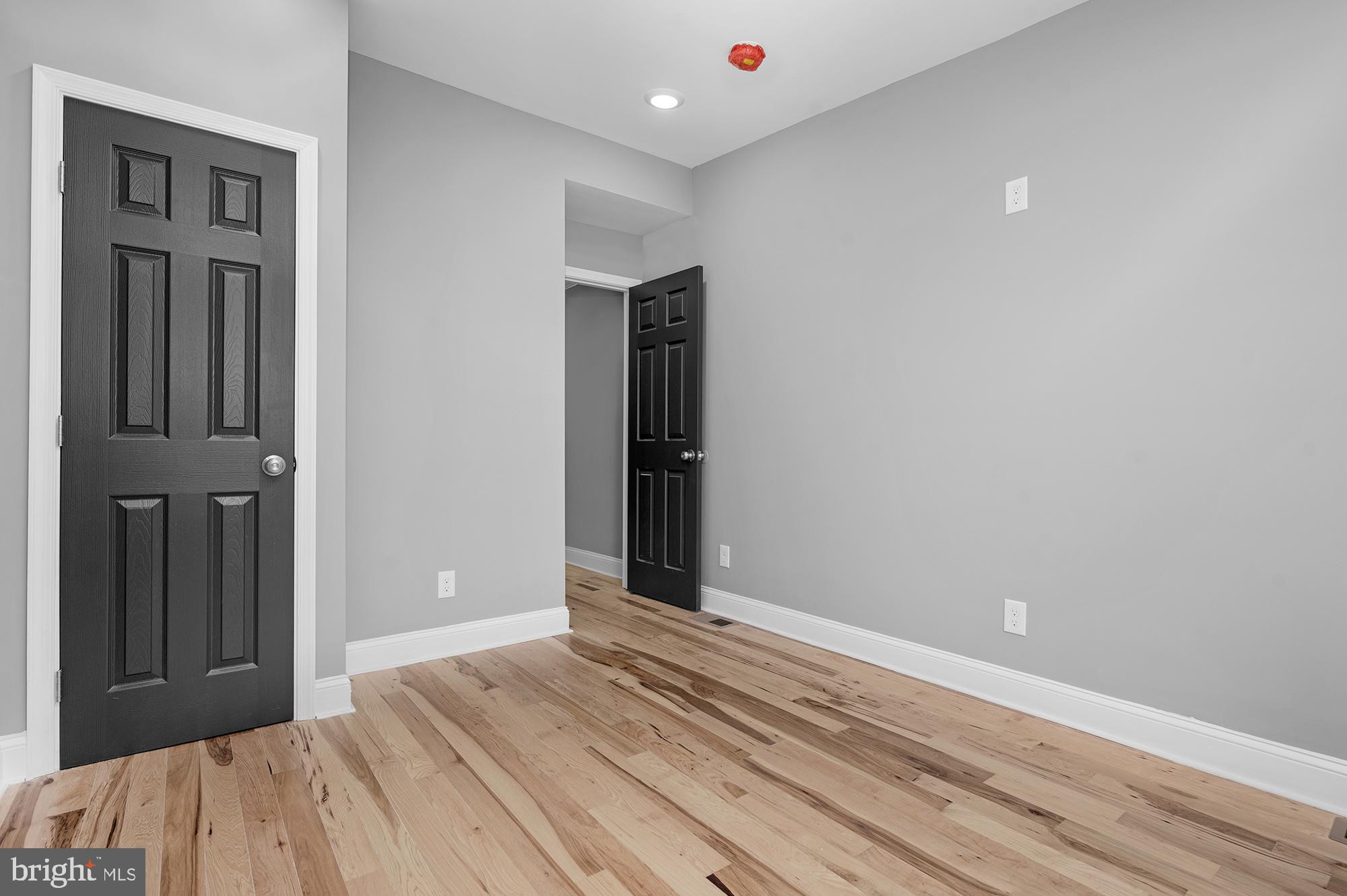 1908 East Lanvale Street Baltimore, MD 21213 - Photo 28 of 49 a view of a livingroom with wooden floor and closet