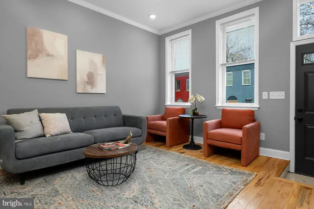 a living room with furniture or couch and a window