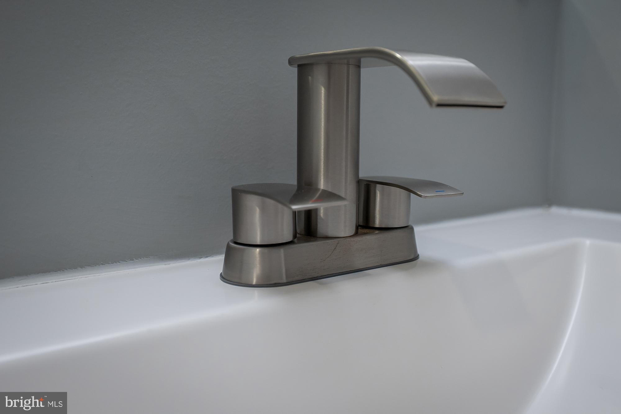 1908 East Lanvale Street Baltimore, MD 21213 - Photo 32 of 49 a bathroom with a sink